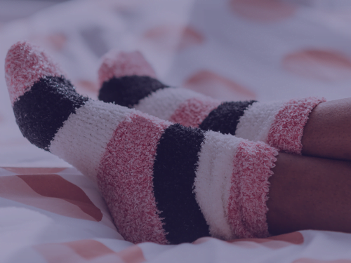 Sokken aan in bed leid tot sneller orgasme